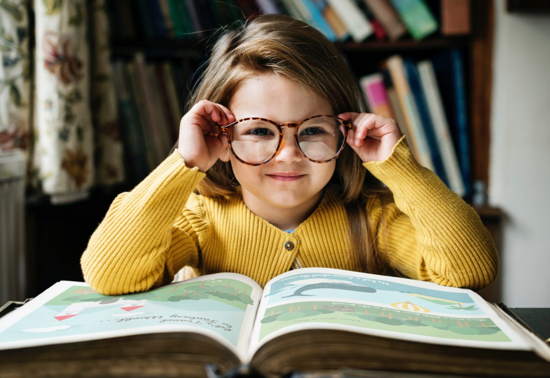 https://www.freepik.com/free-photo/adorable-cute-girl-reading-storytelling-con- cept_18415863.htm